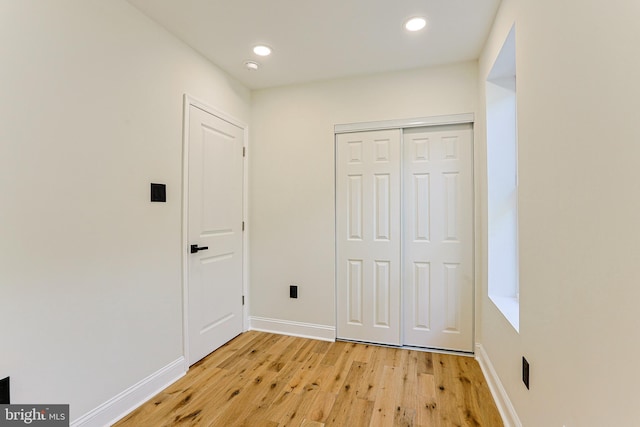 interior space featuring light hardwood / wood-style flooring and a closet