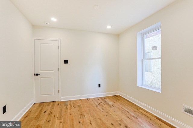 unfurnished room featuring light hardwood / wood-style floors