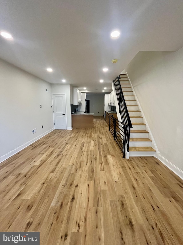 unfurnished living room featuring light hardwood / wood-style flooring