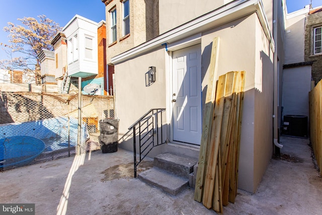 property entrance with cooling unit