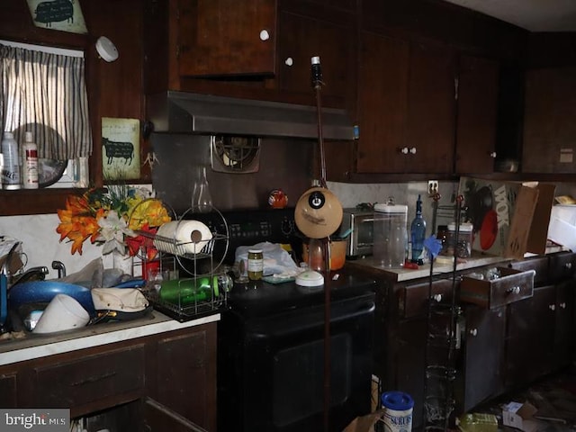 kitchen with dark brown cabinets and exhaust hood