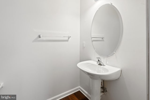 bathroom with hardwood / wood-style floors