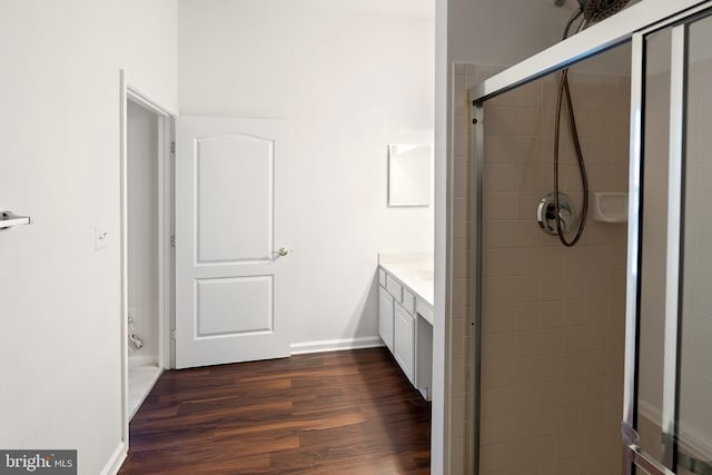 bathroom featuring hardwood / wood-style floors and vanity