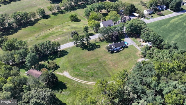 birds eye view of property with a rural view