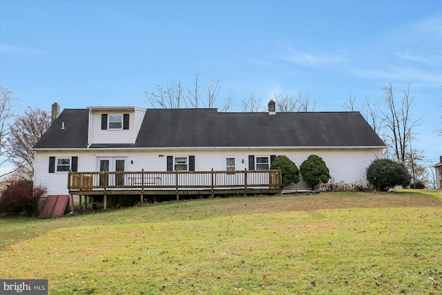 back of house with a yard and a wooden deck