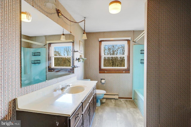 full bathroom with vanity, toilet, baseboard heating, and tub / shower combination