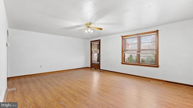 unfurnished room featuring ceiling fan and light wood-type flooring