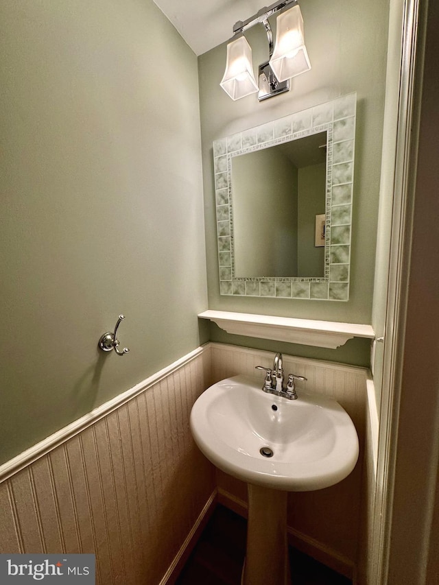 bathroom with wooden walls