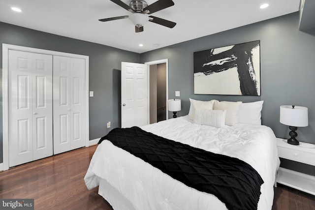 bedroom featuring a closet, ceiling fan, and dark hardwood / wood-style flooring