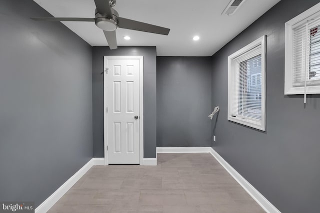 interior space with ceiling fan and a wealth of natural light