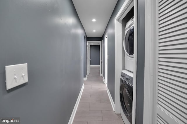 washroom with stacked washer and clothes dryer