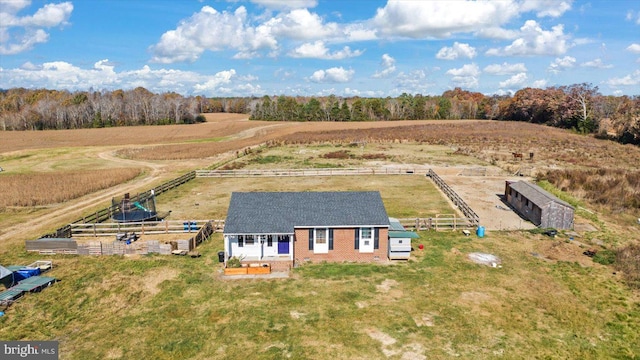 birds eye view of property with a rural view