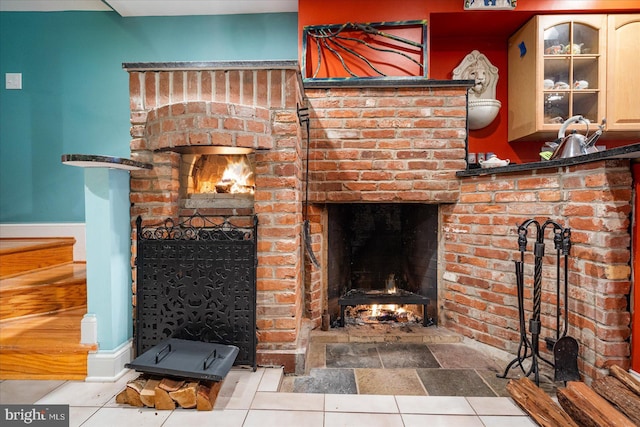 living room with a brick fireplace