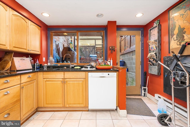 kitchen with sink, white dishwasher, light tile patterned flooring, and a baseboard heating unit