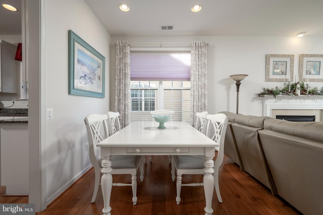 dining space featuring dark hardwood / wood-style flooring