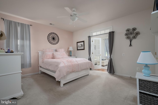 bedroom with light carpet and ceiling fan