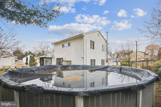 exterior space with a covered pool