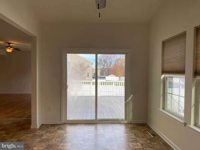 unfurnished dining area featuring hardwood / wood-style floors and ceiling fan