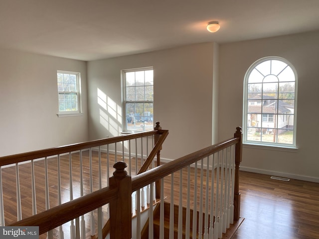 hall with dark hardwood / wood-style floors