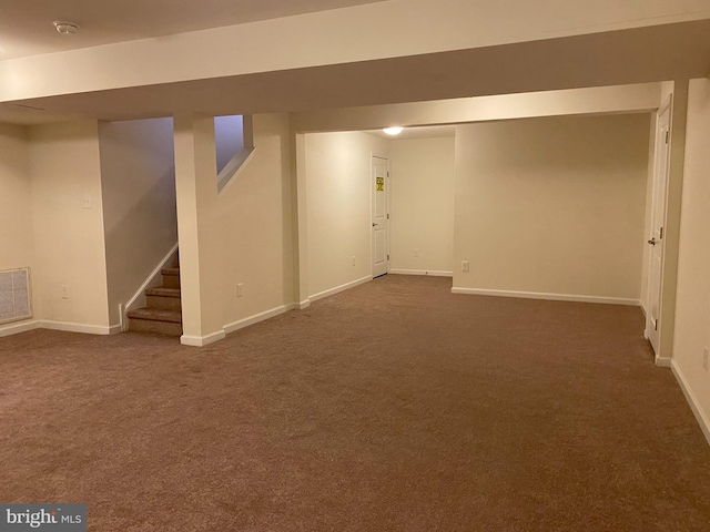 basement with dark carpet