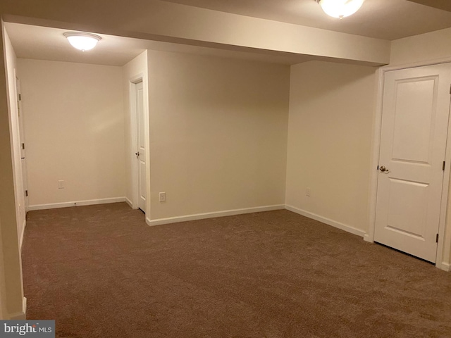 basement with dark carpet