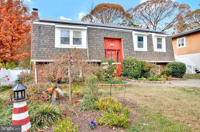 view of front of house with solar panels