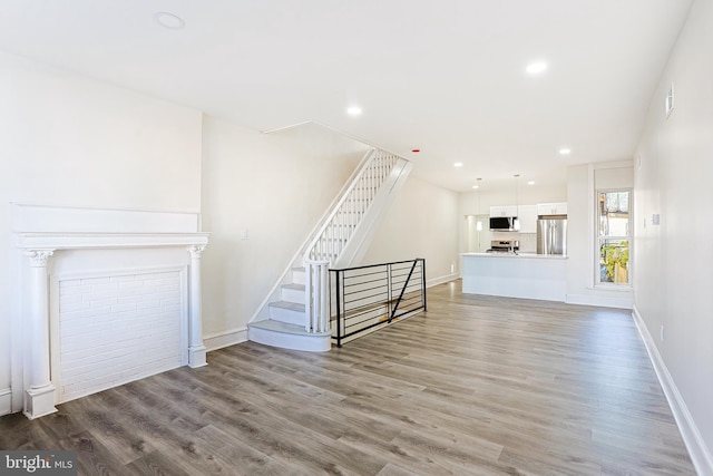 unfurnished living room with light hardwood / wood-style floors