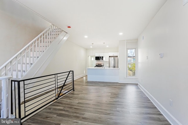 interior space with hardwood / wood-style flooring