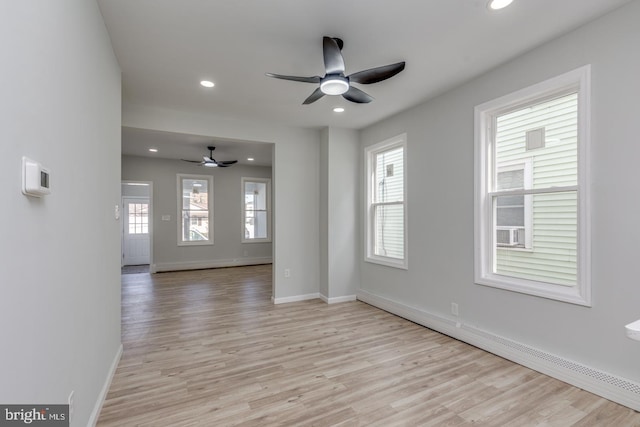 interior space with light hardwood / wood-style flooring, plenty of natural light, and ceiling fan