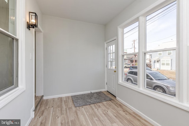 entryway with light hardwood / wood-style flooring