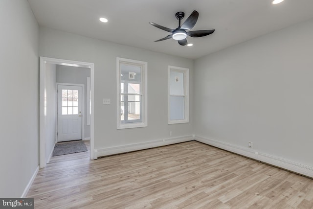 spare room with ceiling fan and light hardwood / wood-style floors