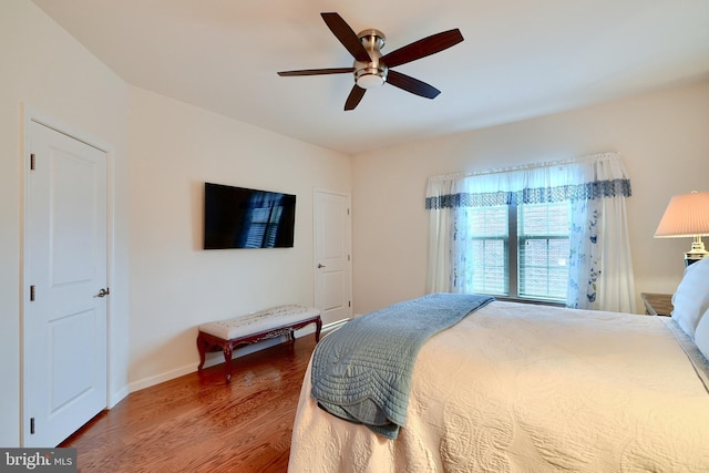 bedroom featuring hardwood / wood-style flooring and ceiling fan