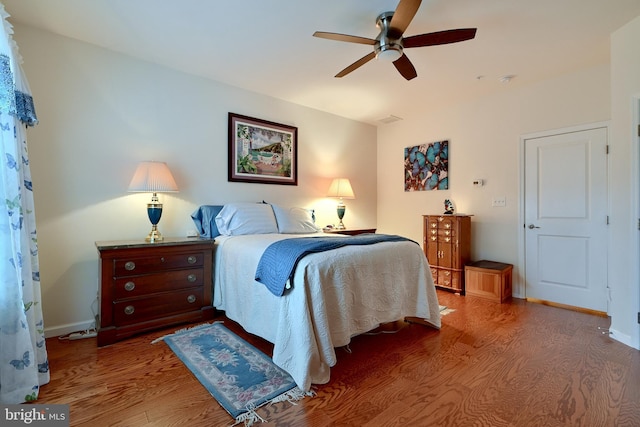 bedroom featuring hardwood / wood-style flooring and ceiling fan