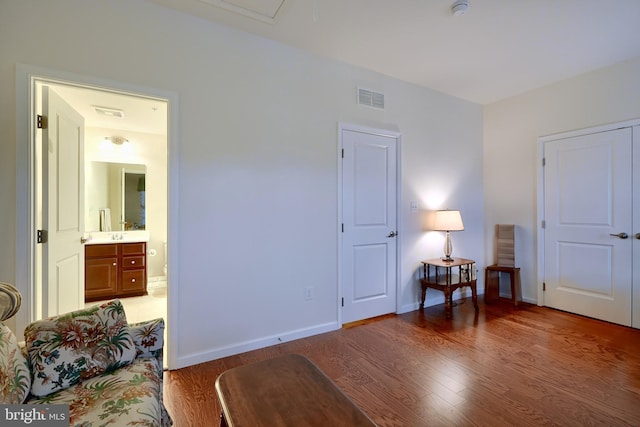 living area with hardwood / wood-style floors