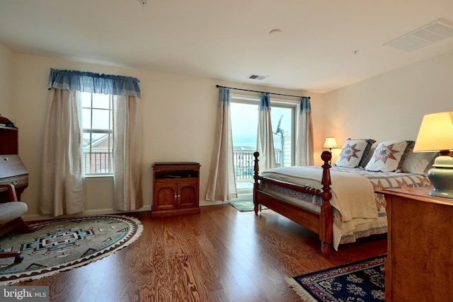 bedroom featuring hardwood / wood-style floors and access to exterior