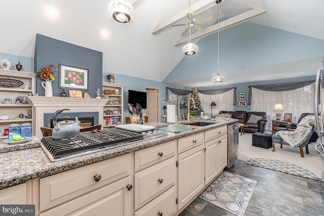 kitchen featuring ceiling fan, sink, hanging light fixtures, stainless steel appliances, and lofted ceiling