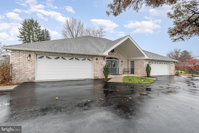 ranch-style house featuring a garage