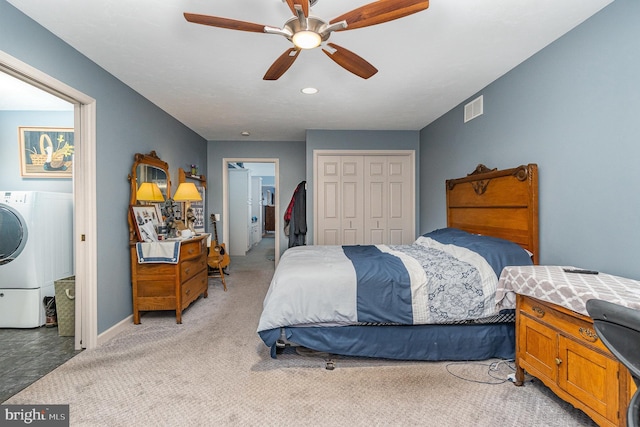 carpeted bedroom with connected bathroom, washer / clothes dryer, and ceiling fan