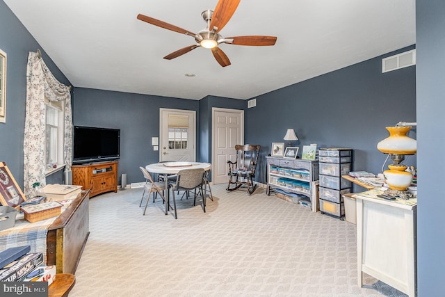 interior space with ceiling fan