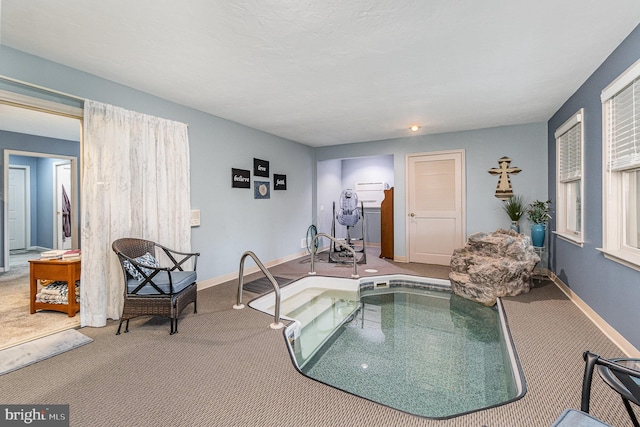 view of pool featuring a jacuzzi