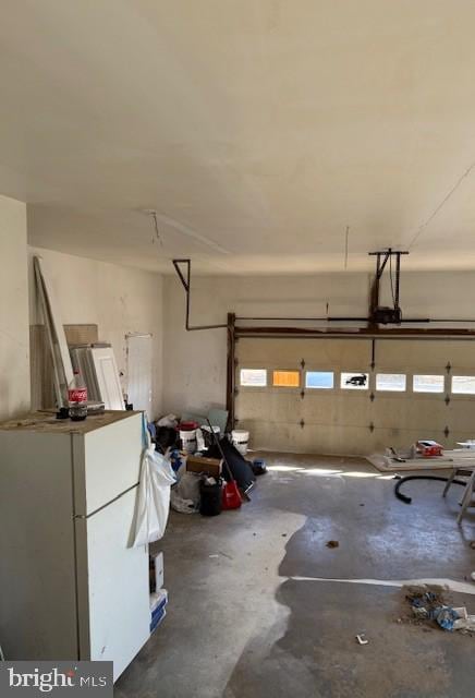 garage with freestanding refrigerator