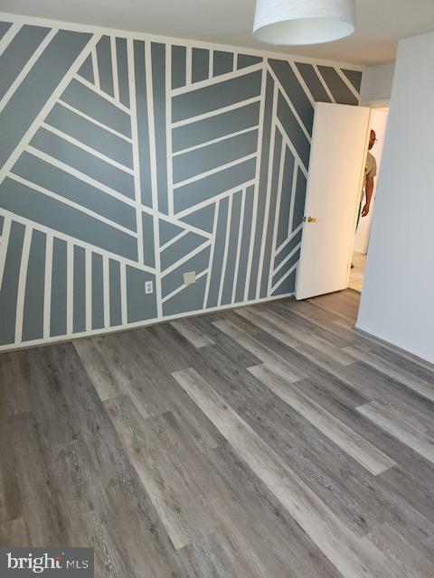 unfurnished living room featuring hardwood / wood-style flooring