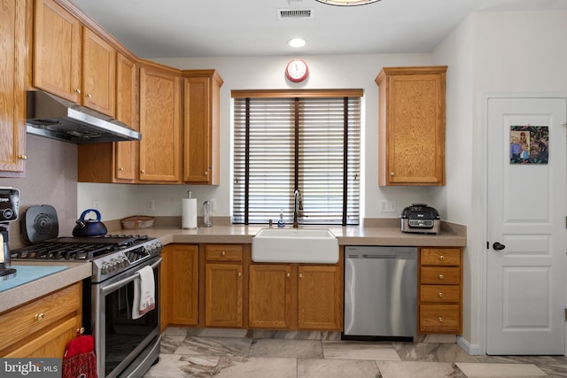 kitchen with appliances with stainless steel finishes and sink