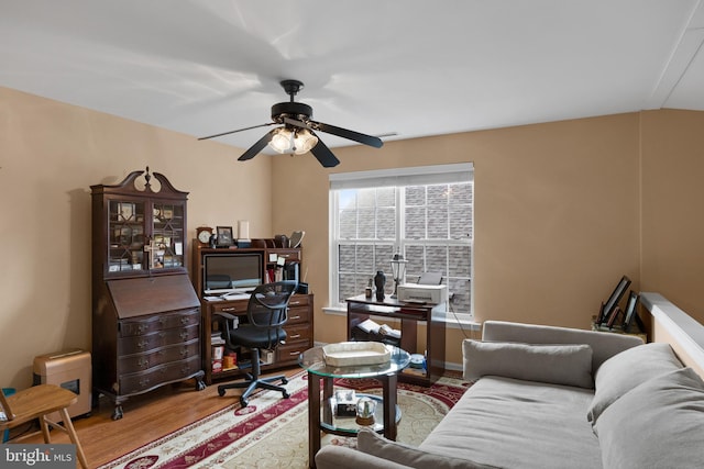 home office featuring hardwood / wood-style flooring and ceiling fan