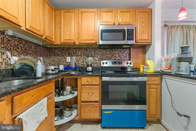 kitchen featuring dark stone counters, decorative backsplash, pendant lighting, and stainless steel appliances