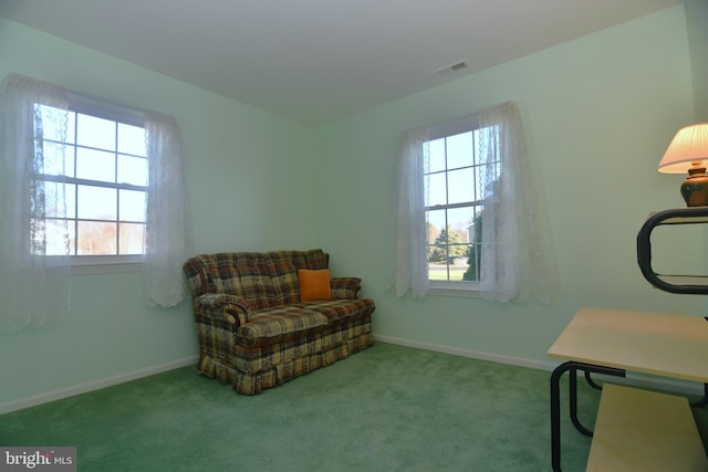 living area with light carpet