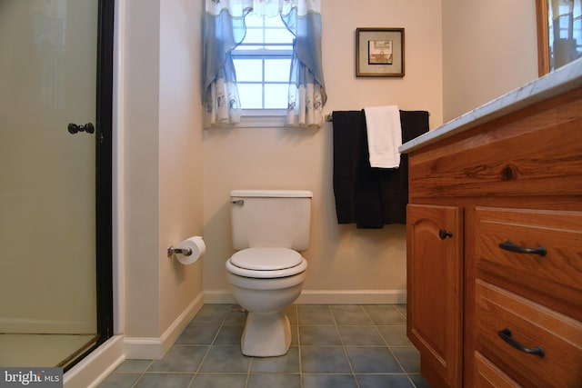 bathroom with tile patterned floors, an enclosed shower, and toilet