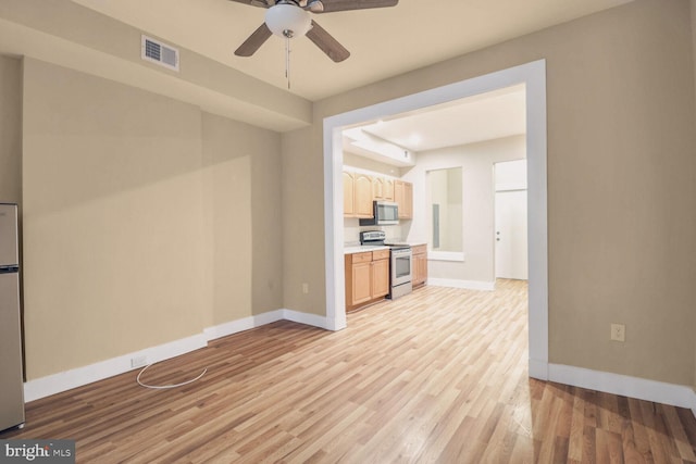 unfurnished living room with light wood-type flooring and ceiling fan