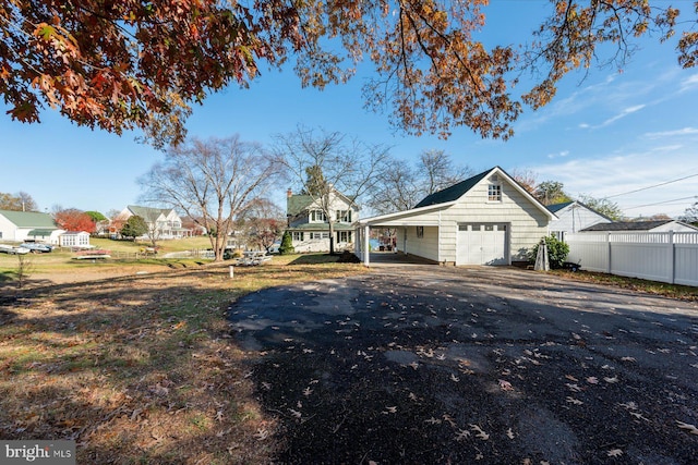 exterior space featuring a garage and an outdoor structure