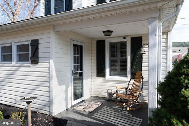 view of exterior entry with covered porch